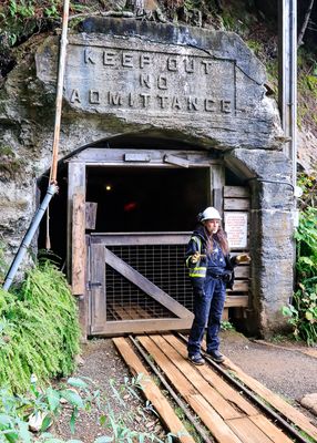 Guide at the mining tunnel entrance at the Britannia Mine National Historic Site