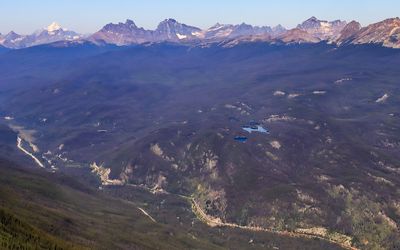 Mount Robson (left, 12,972 ft), highest peak in the Canadian Rockies, as seen from Jasper National Park