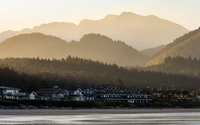 The town of Cannon Beach and the surrounding hills and mountains at sunrise as seen from on Cannon Beach