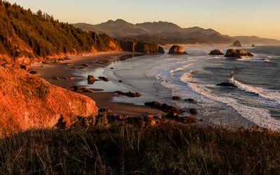 The sun sets on the beach in Ecola State Park along the Oregon Coast