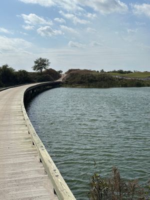 StreamSong - ch - The Chains - hole 11 - walk over long bridge to green.jpg