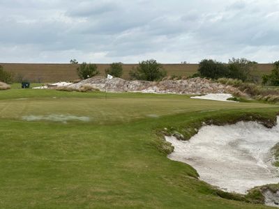 StreamSong - cu - The Chains - hole 14 - result - left to right wind - ball into bunker.jpg