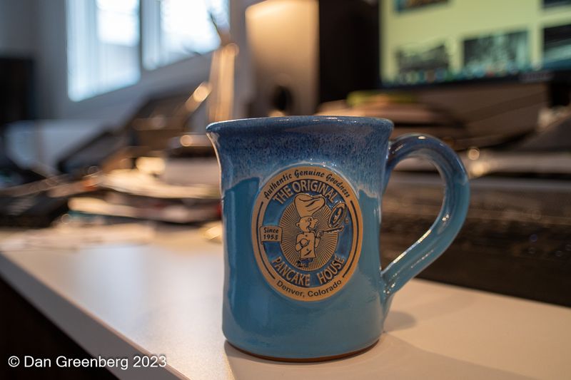 Coffee Cup on a Messy Desk