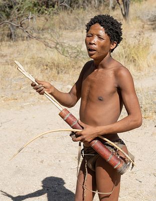 One of the San people explaining some of the way they hunt