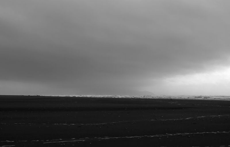Kapiti Island from Ōtaki Beach on a bleak day