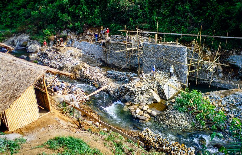 Bridge Building - obviously in the mountains somewhere judging by the clean water - awesome rock facing to piers