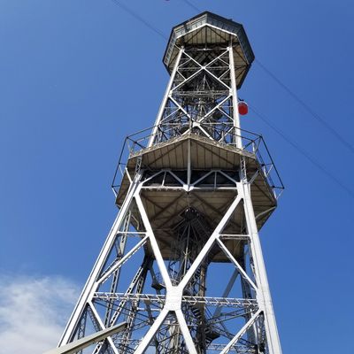 Teleferic to Montjuic with one red cable car about to stop