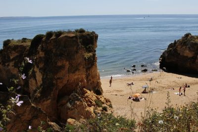 Just one of many Algarve beaches -  sand, sun, rocks, caves. And Lagos has places to eat, shop & enjoy life without big crowds.