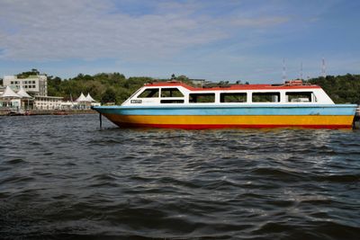 A somewhat official looking boat (ferry?)