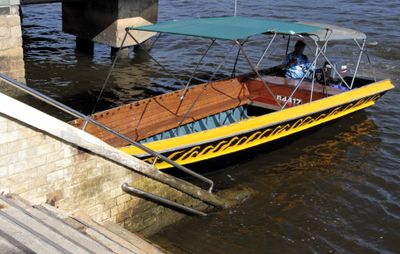 Then 10 of us boarded this boat for a trip across the water to the stilt community