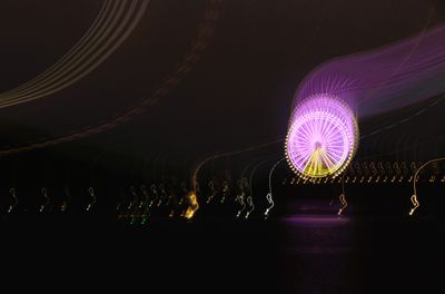 The ship left Nha Trang at 6. The ferris wheel from Vinpearl Park across the way was colorful.
