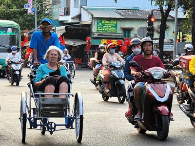 Ruth enjoyed the cyclo ride through streets & alleys of Ho Chi Minh City