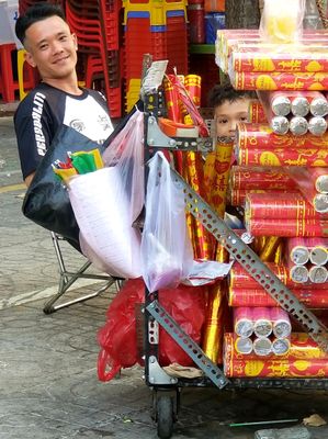 Fireworks seller with curious son