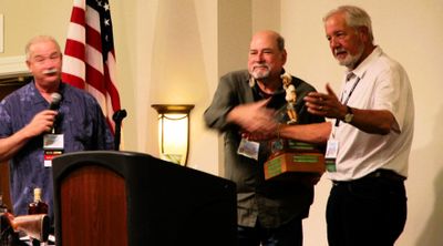 Howard & Gary accept Walter (trophy) for 5 golf winners (Wintergreen this year).