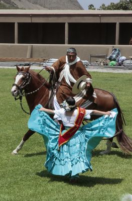 Horseman with senora dancing