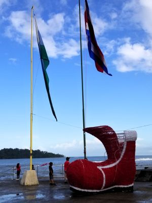 Big shoe stands in front of the Caribbean Sea.  Did Santa come?
