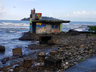 Delapidated structure at waterfront near the shoe.