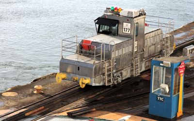 Mule throws ropes to the ship front & back & runs alongside on the breakwater to guide ship.