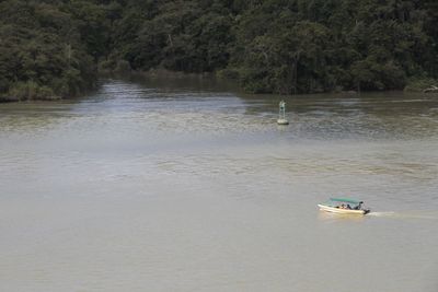 Small boat in huge lake. Indigenous people live here & Nat Geo brings visitors here.
