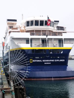 Small Nat Geo cruise ship at old harbor 