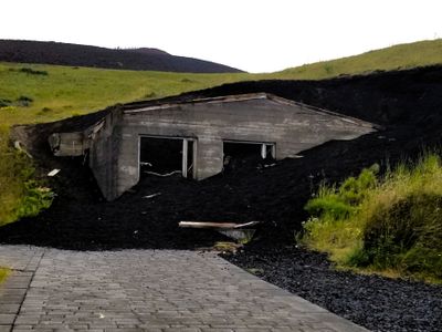 A house still stands ruined outside the Eldheimer Museum