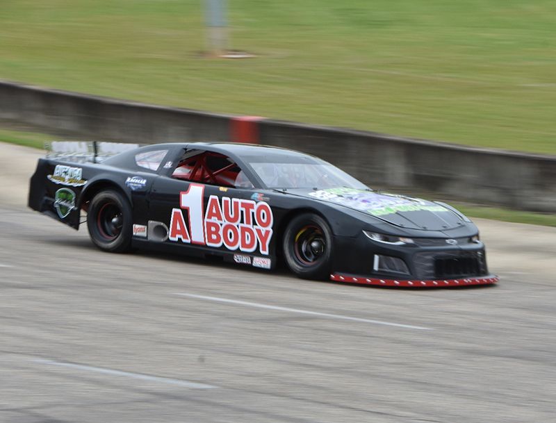 A car doing practice laps at Montgomery Motor Speedway
