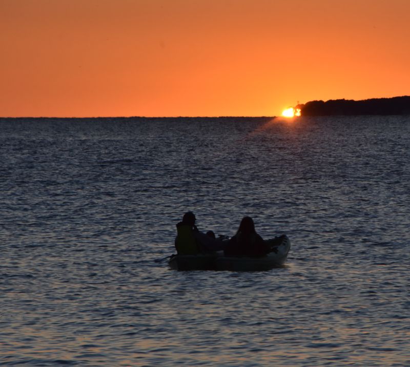 Kayakers at sunset