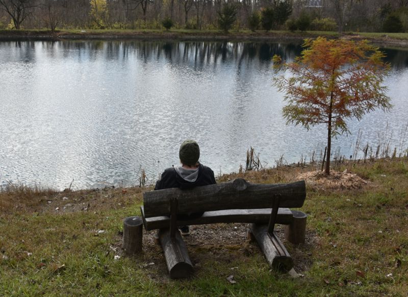 Relaxing on the pond bench