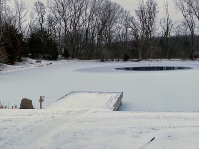 Our pond aerator is keeping the ice off in one area. (5 thick in other areas)