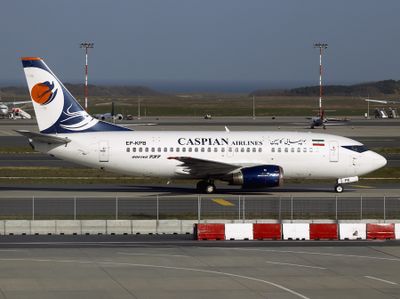 Caspian Airlines departs Istanbul LTFM on a Sunny Winter's day,
as seen from the concourse window here.