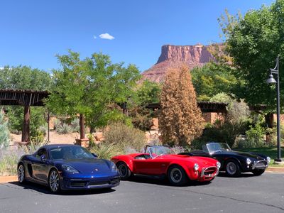 2021 Porsche 718 Boxster S next to genuine Shelby AC Cobras from the 1960s at Gateway Canyons Resort. (8920)