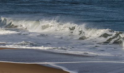 Ocean waves by beach.jpg