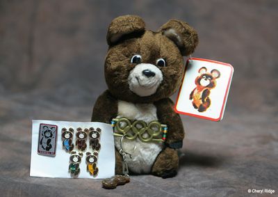Misha bear plush and pin badges