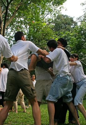 Bu Haji being passed over.jpg