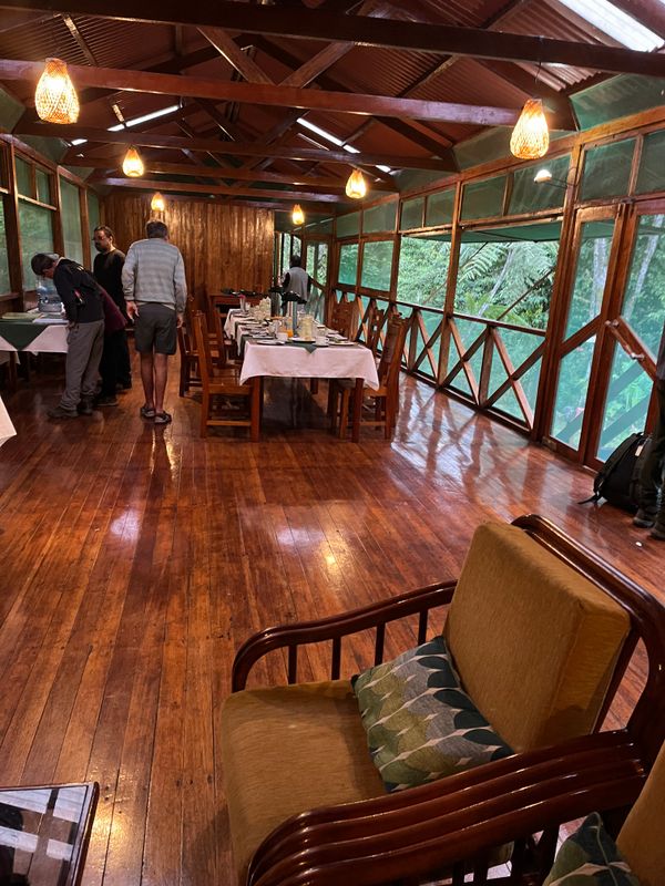 Dining hall Cock of the Rock Lodge overlooking the bird feeders to the right