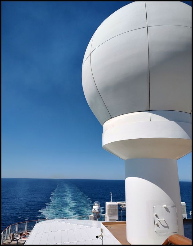 UP TOP ON THE BACK OF THE SHIP