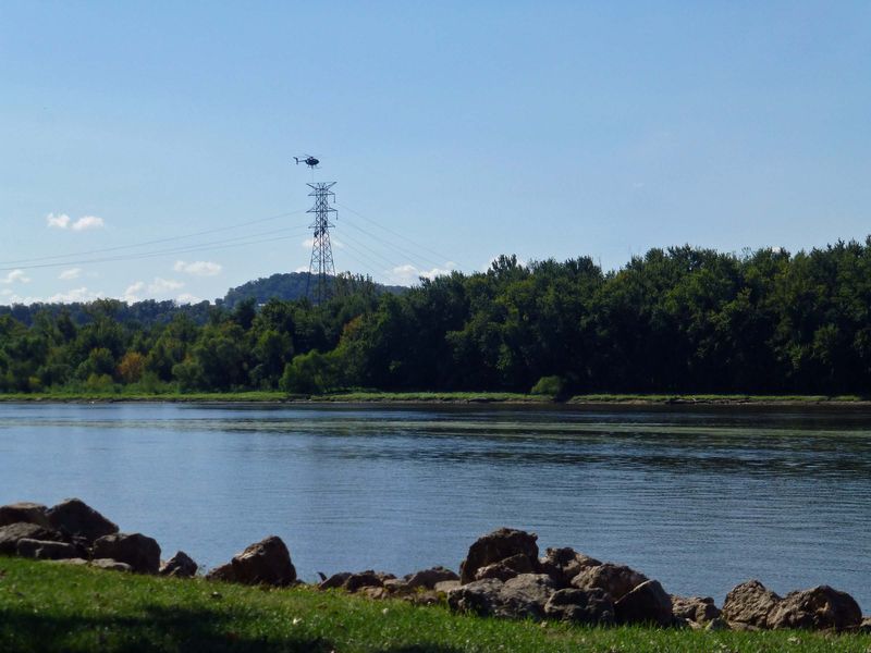 Helo carries workers to the job