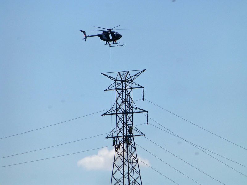 Helo carries works to the job closer view