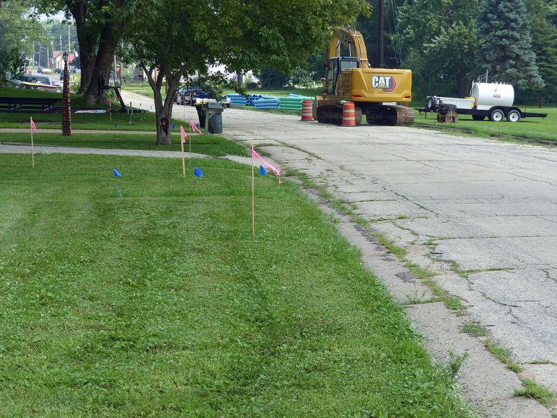 Blue flags and a shovel