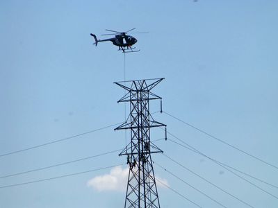 Helo carries works to the job closer view
