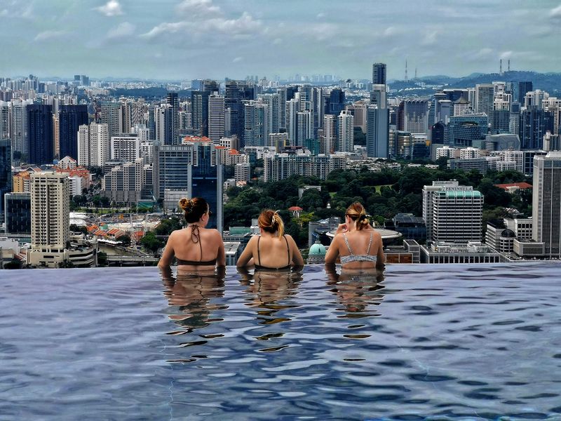 Infinity Pool of Sands Hotel facing Singapore city from 57 levels above
