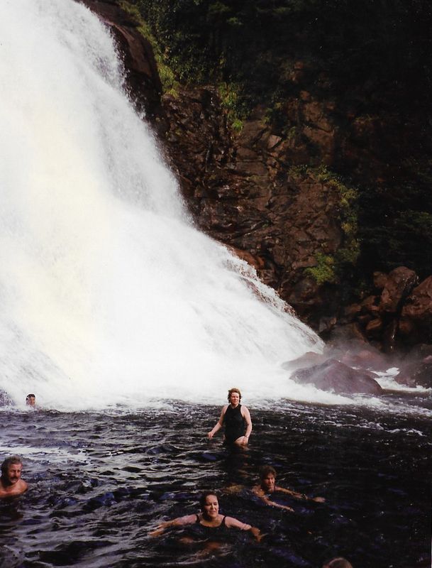 People bathing at bottom of Angel Falls