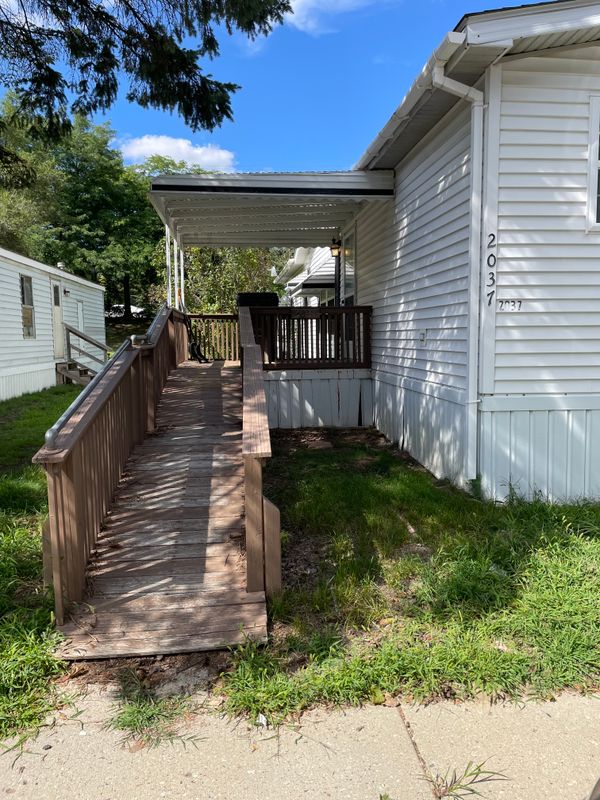 Here is your ramp and covered deck. If you want to take out the ramp, there may be steps underneath.