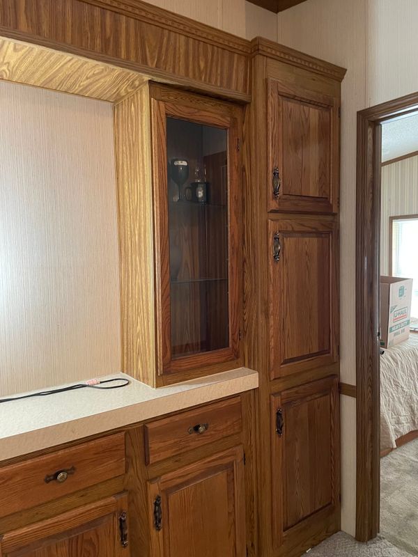 Foyer cabinets, going right toward primary bedroom. See the closed tall storage?