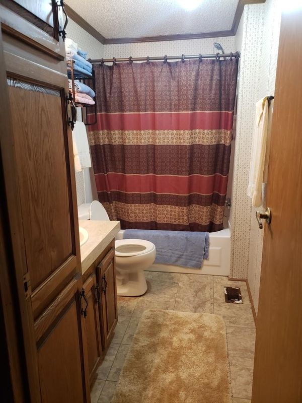 Second bathroom, first door on left