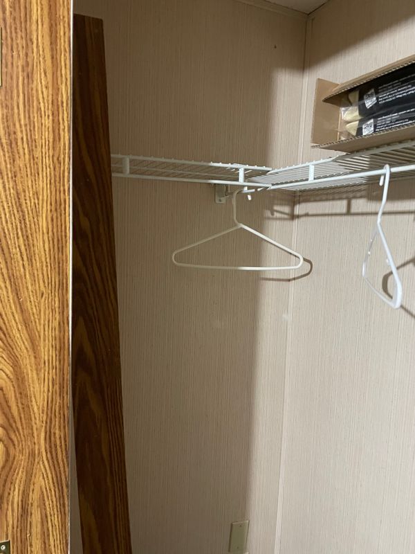 Second bedroom closet is deep with hanging space on sides. Three sided shelf, too.