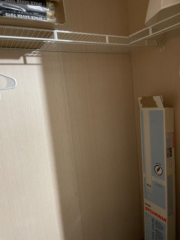 Right side of closet in second bedroom.