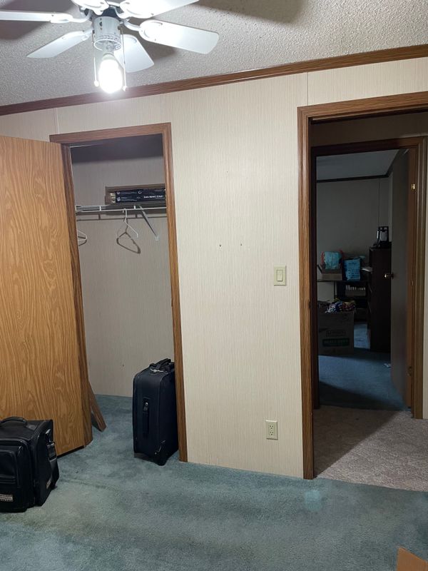 L-to-R: second bedroom closet door, room door, and the door to the third bedroom across the hall.