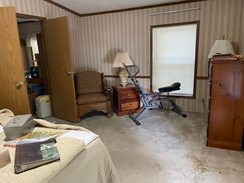 Standing at foot of bed, here is a view of the rest of the room, with double doors to den/nursery/office.