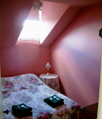 A cosy attic bedroom on a wild and woolly night